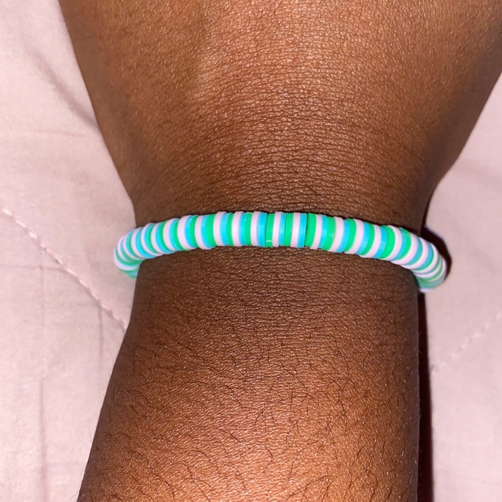 light pink, dark green, and light blue bracelet